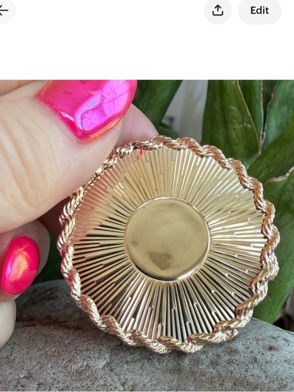 Sold.    14 karat gold, oversized charm